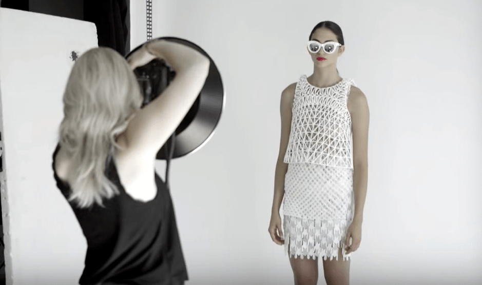 A person standing in front of a mirror posing for the camera
Description automatically generated